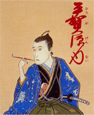 男性がキセルで煙草を吸っている浮世絵の写真